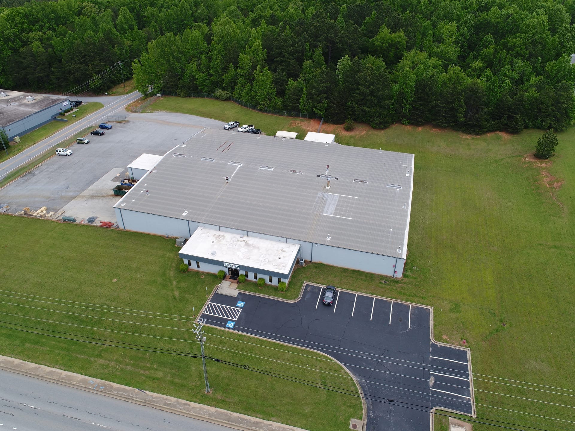 Aerial view of a commercial facility in Upstate South Carolina surrounded by broad, evenly cut turf
